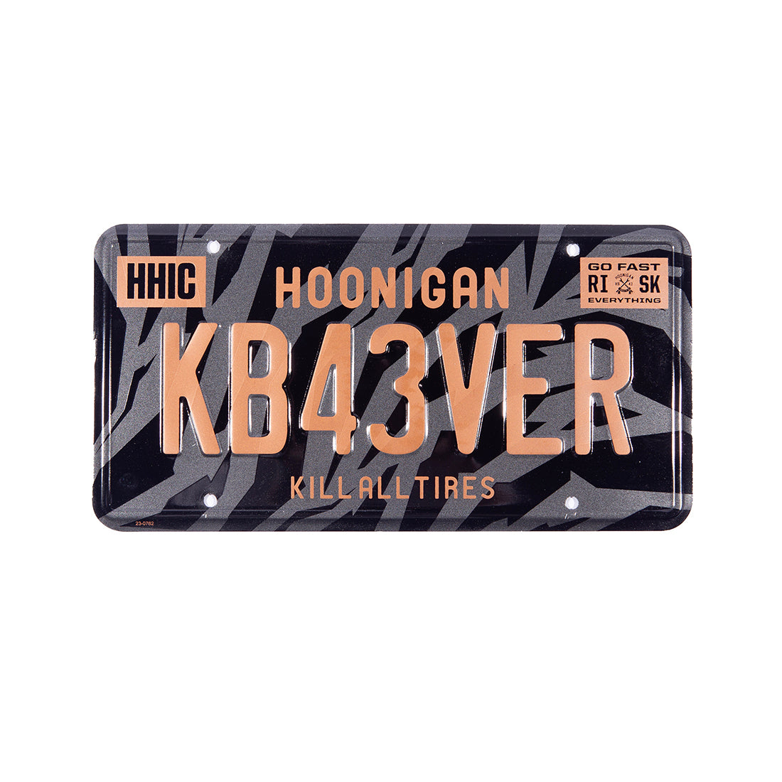 Hoonigan GYMKHANA7 metal license plate featuring a bold graphic design, mainly in black and white, with "GYMKHANA7" text prominently displayed.