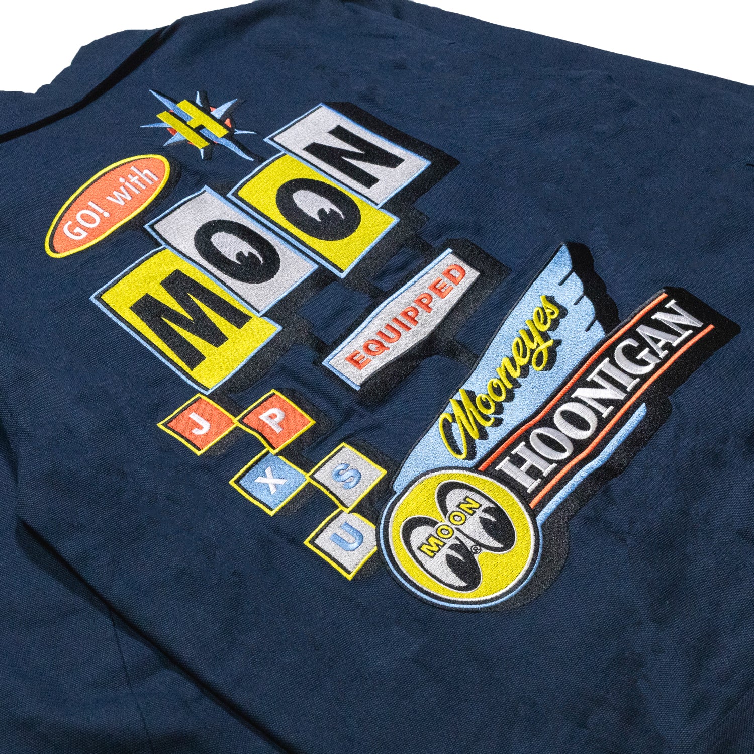 Hoonigan x Mooneyes MOON MOTEL jacket featuring a black and yellow design with bold graphics and a classic jacket silhouette.