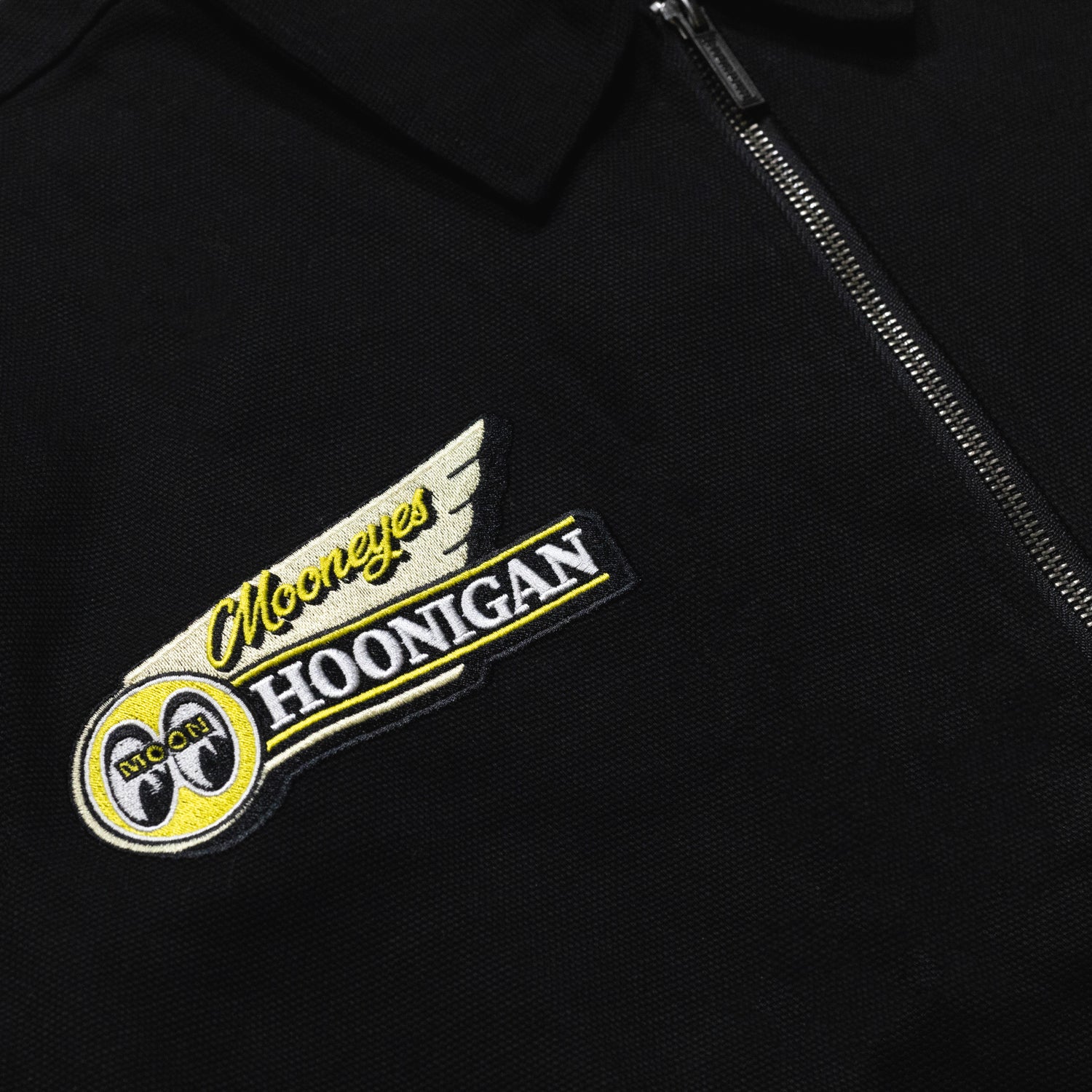 Hoonigan x Mooneyes MOON MOTEL black jacket featuring a retro motel graphic and logo on the back.