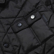 Hoonigan Motorsports VICTOR Quilted Jacket in black featuring a zip-up front, quilted design, and embroidered logo on the chest.