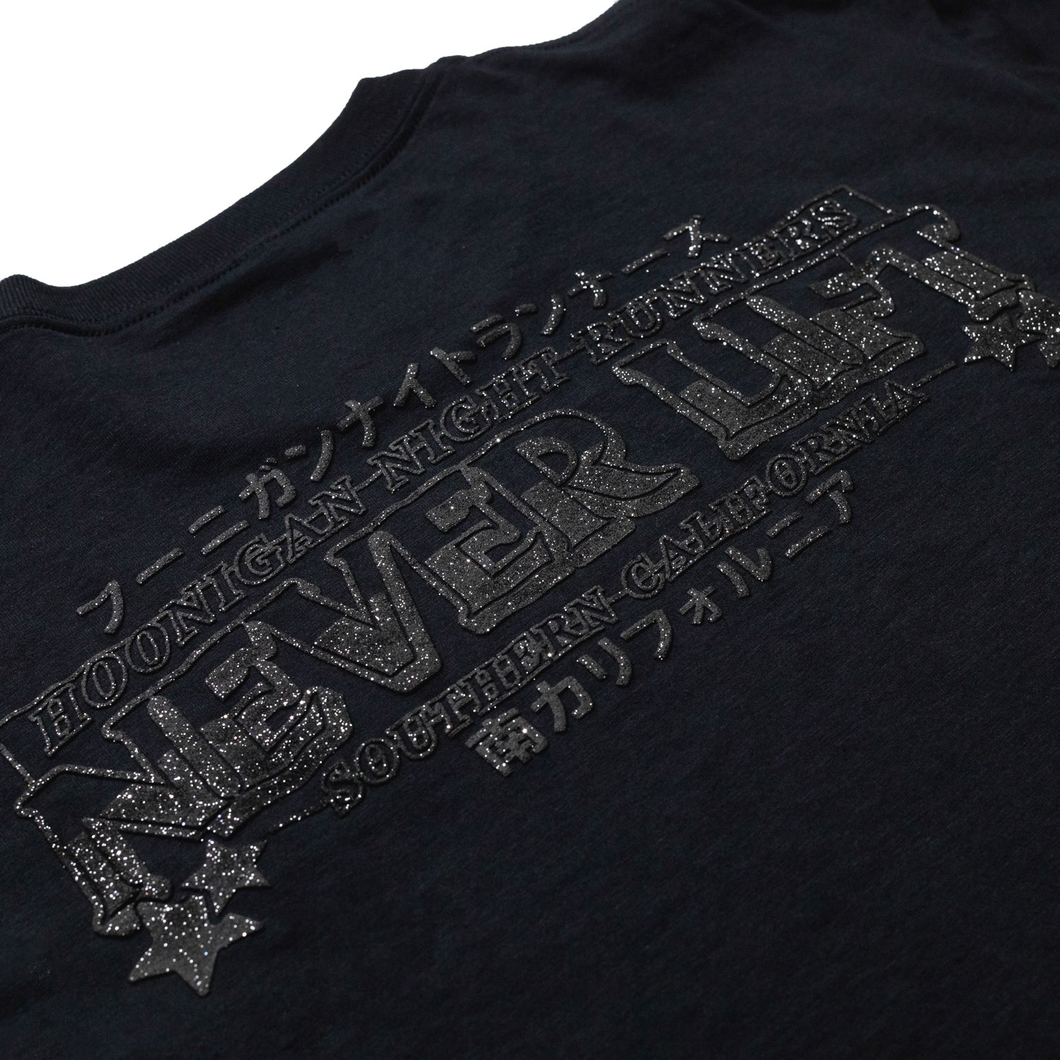 Hoonigan NIGHT RUNNERS Short Sleeve Tee featuring a graphic design on a black fabric background.