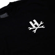 Hoonigan MAYHEM Short Sleeve Tee featuring a bold graphic design on a black fabric, perfect for motorsport enthusiasts.