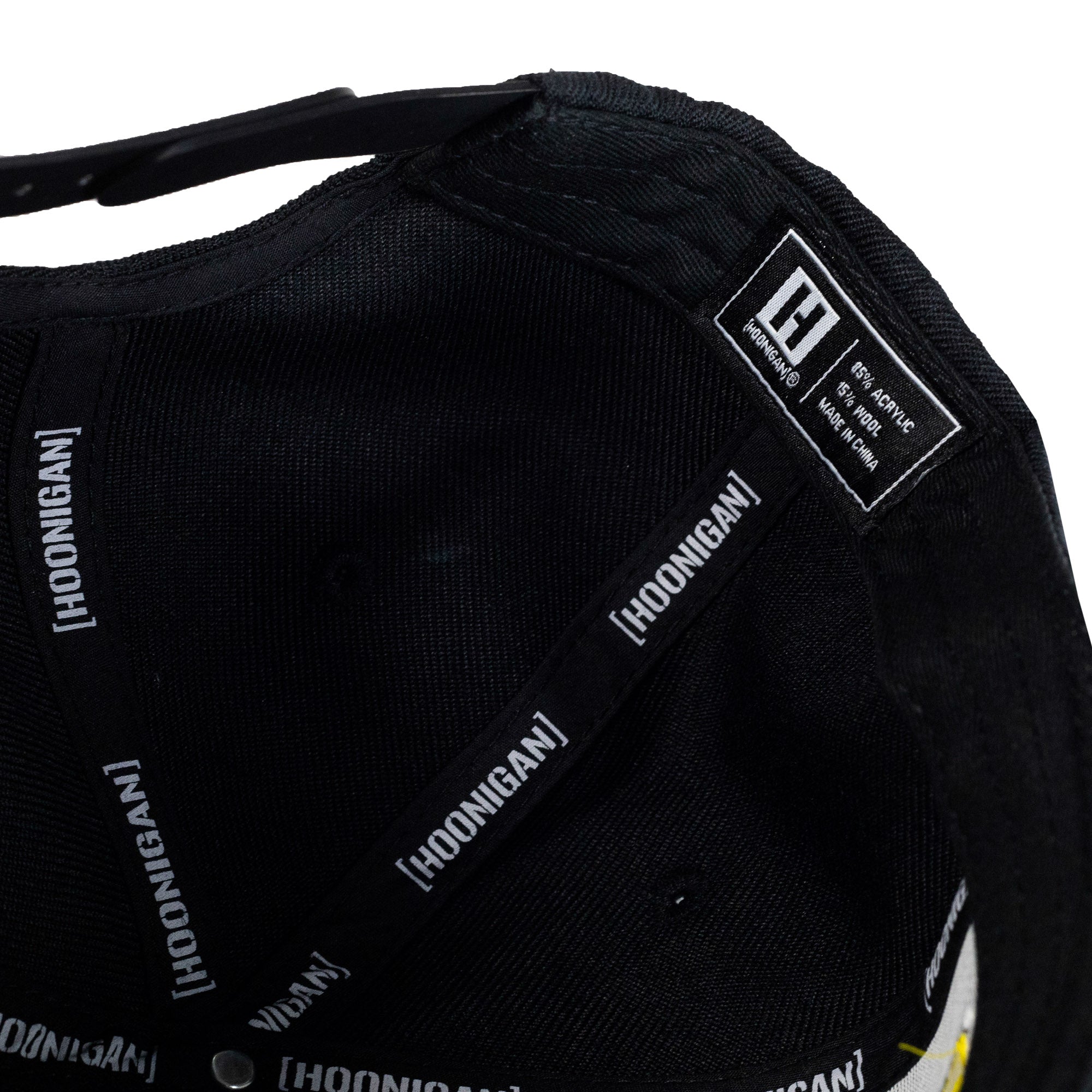 Hoonigan KING OF MONSTERS 6 Panel Snapback Hat in black with vibrant graphic detailing on the front.