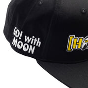 Hoonigan x Mooneyes MOON BAR Snapback Hat featuring a black cap with white logo embroidery and a flat brim.