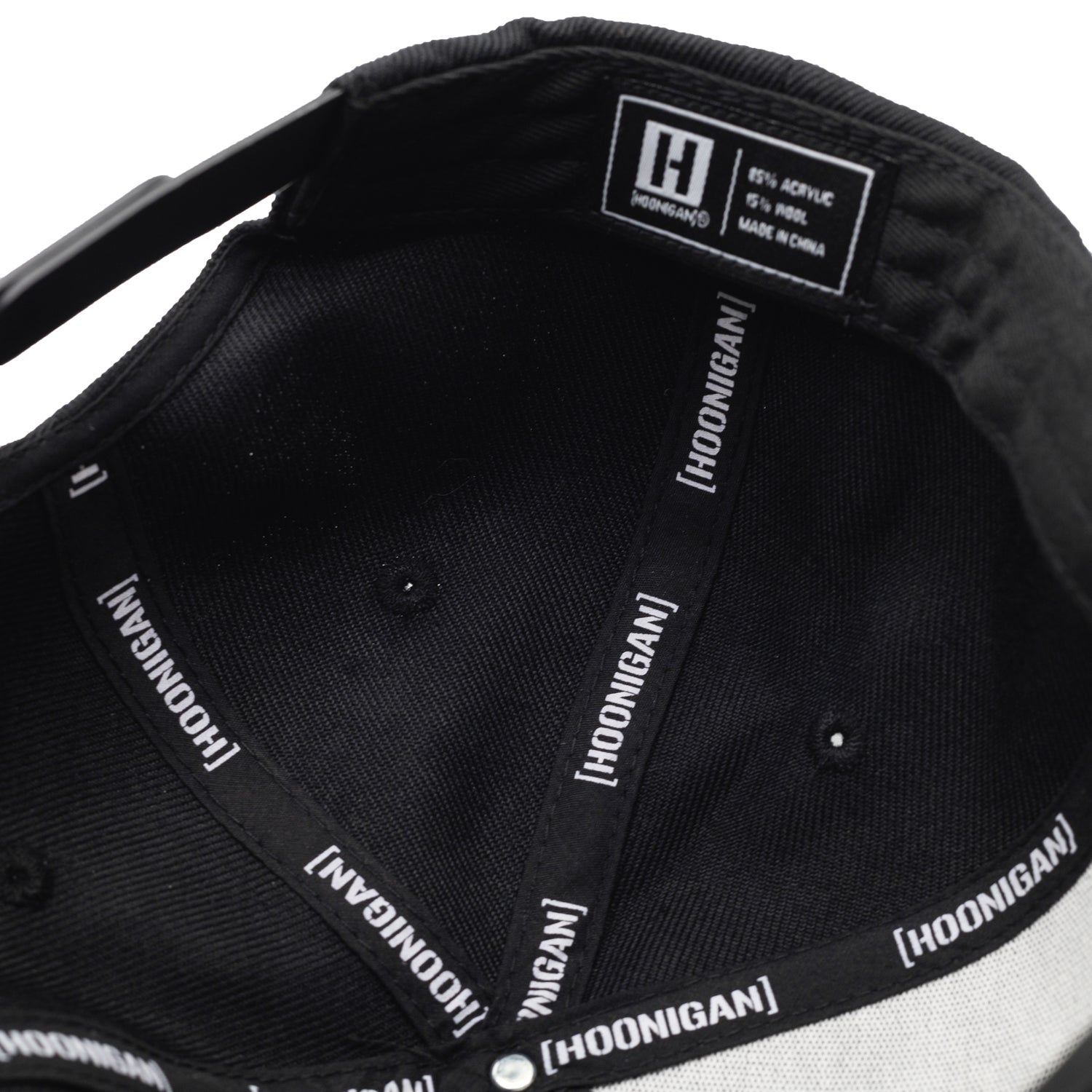 Hoonigan HNGN POWER Snapback Hat in black with white logo embroidery and adjustable strap.