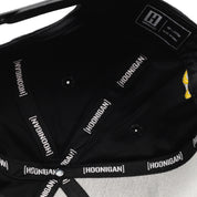 Hoonigan x Mooneyes SO CAL Snapback Hat in black with white logo, featuring a flat brim and adjustable strap.