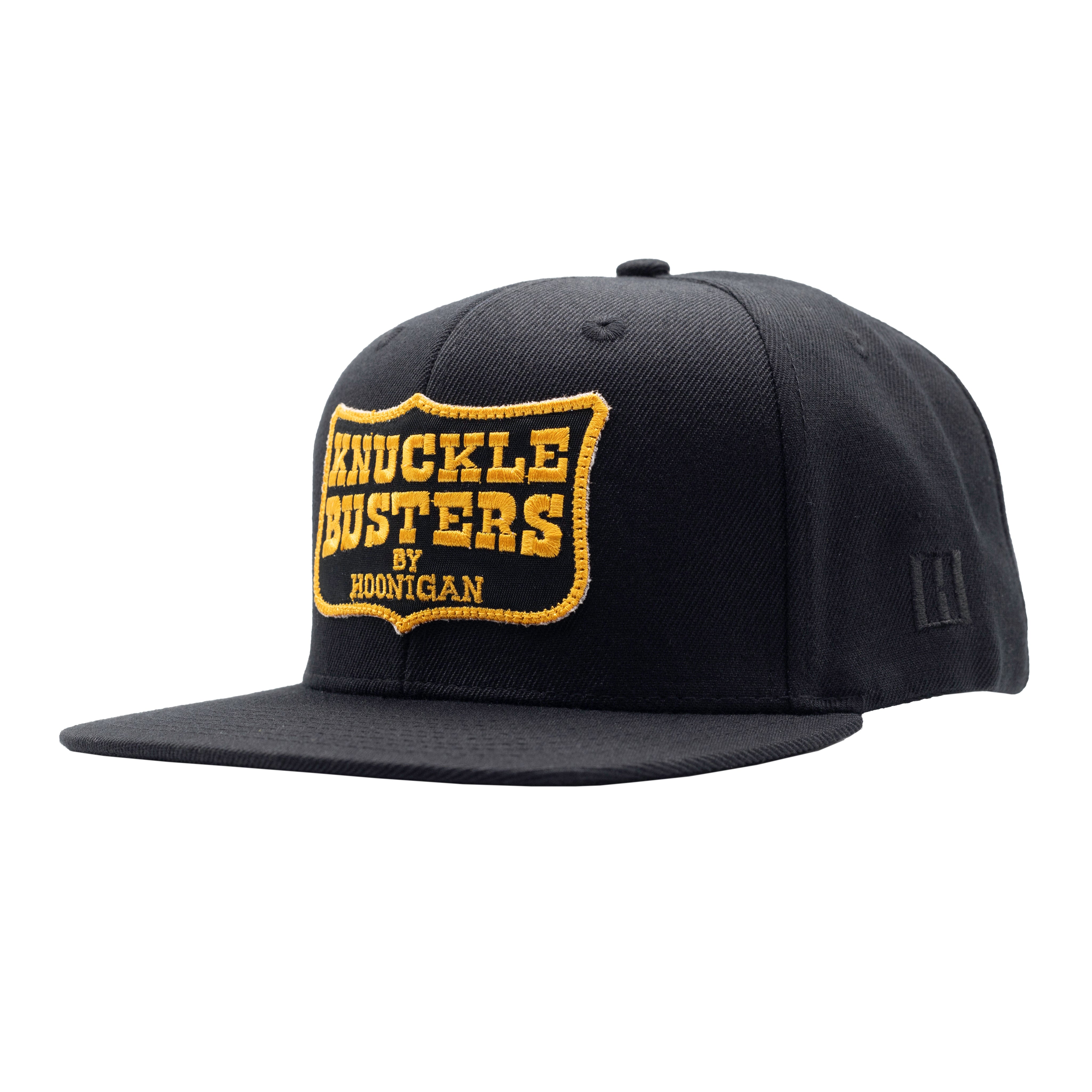 Hoonigan Belt Sander Snapback Hat featuring a black and orange design with bold graphics.