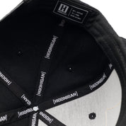 Hoonigan BELT SANDER Snapback Hat featuring a black base, bold graphics on the front, and an adjustable snapback design.