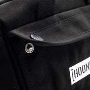 Hoonigan CENSOR BAR Tool Bag in black with Hoonigan logo, featuring multiple pockets and straps for tools and accessories.