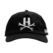 Hoonigan MAYHEM Unstructured Strapback Hat in black with white logo, front view.