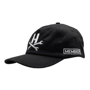 Hoonigan MAYHEM Unstructured Strapback Hat in black with white logo, featuring a relaxed fit and adjustable strap.