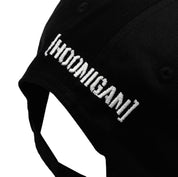 Hoonigan MAYHEM unstructured strapback hat with embroidered logo on front, featuring a black twill fabric and adjustable back strap.