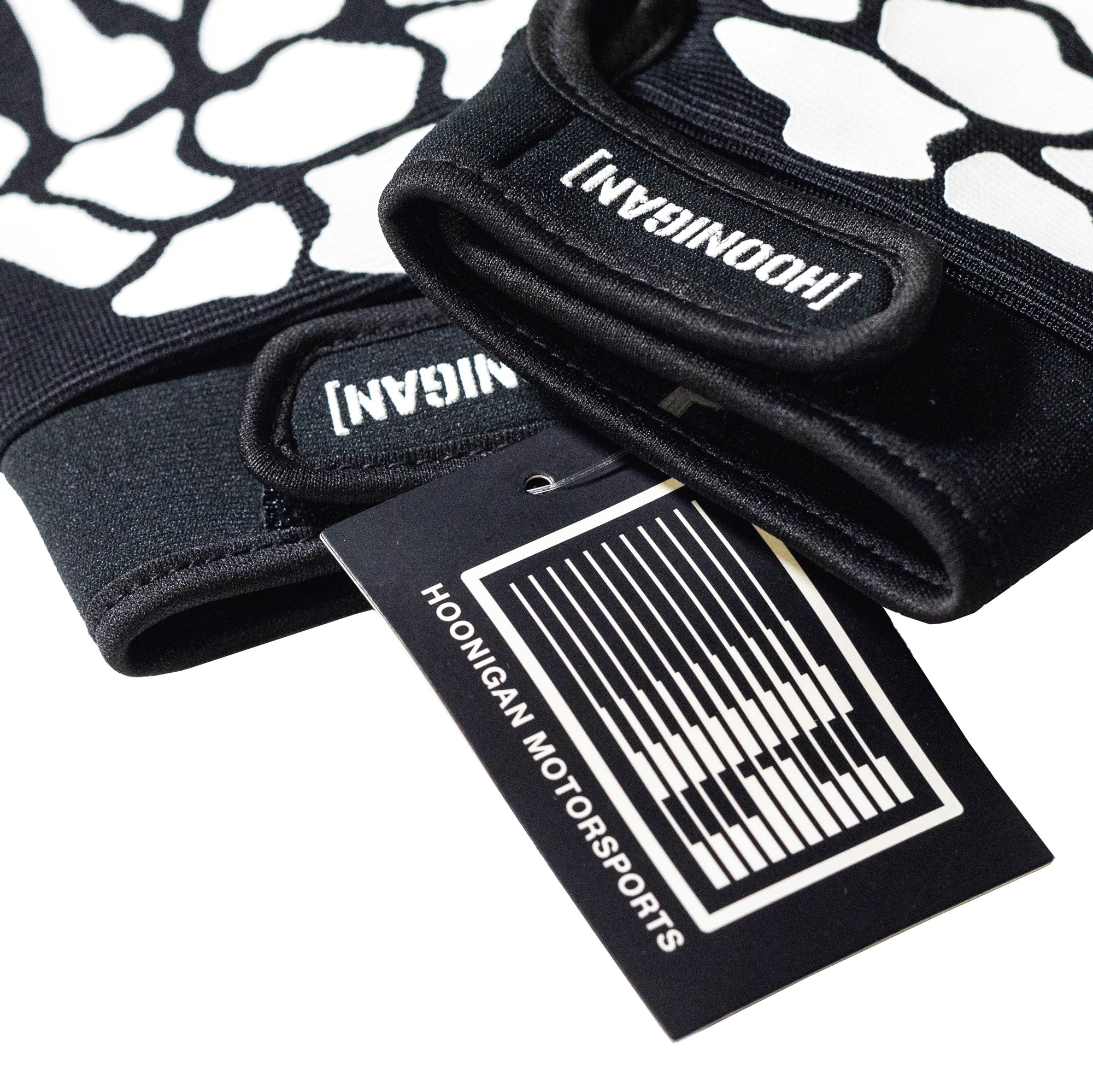 Hoonigan FIND OUT Gloves, featuring a black and white design with bold graphics and a snug fit for enhanced grip.