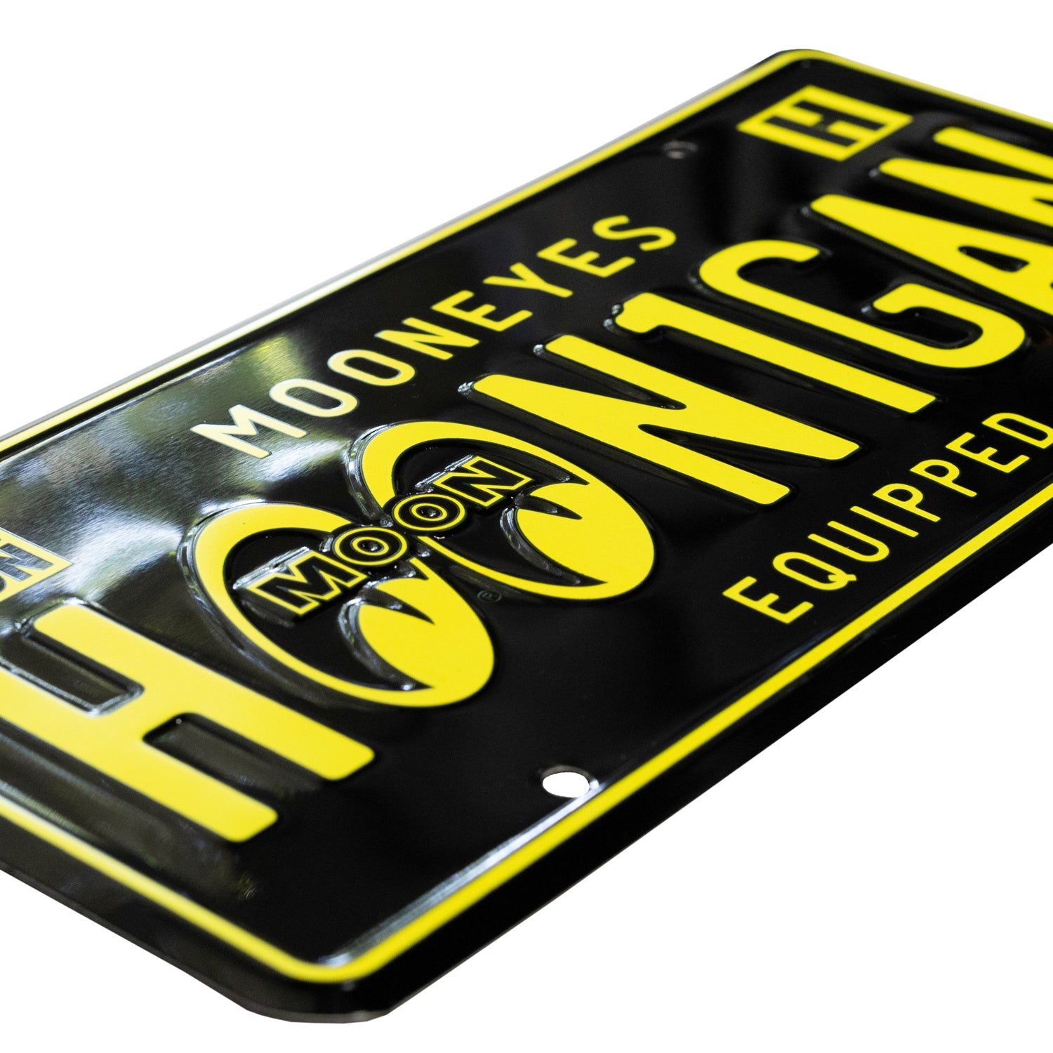 Hoonigan x Mooneyes EQUIPPED license plate featuring bold yellow lettering on a black background, perfect for car enthusiasts.