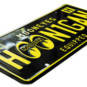 Hoonigan x Mooneyes EQUIPPED license plate featuring bold yellow lettering on a black background, perfect for car enthusiasts.