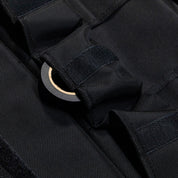 Close-up of the Hoonigan LIL TOOL ROLL showcasing durable black fabric and a secure fastening system for tools.