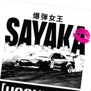 Hoonigan x Sayaka BOMB GIRL Poster, 16"x20", featuring vibrant graphic artwork of a bomb girl character in a dynamic pose.
