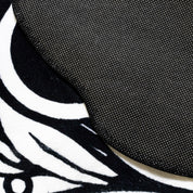 Hoonigan WORLDWIDE 3.75-foot rug featuring a bold graphic design in black and white.