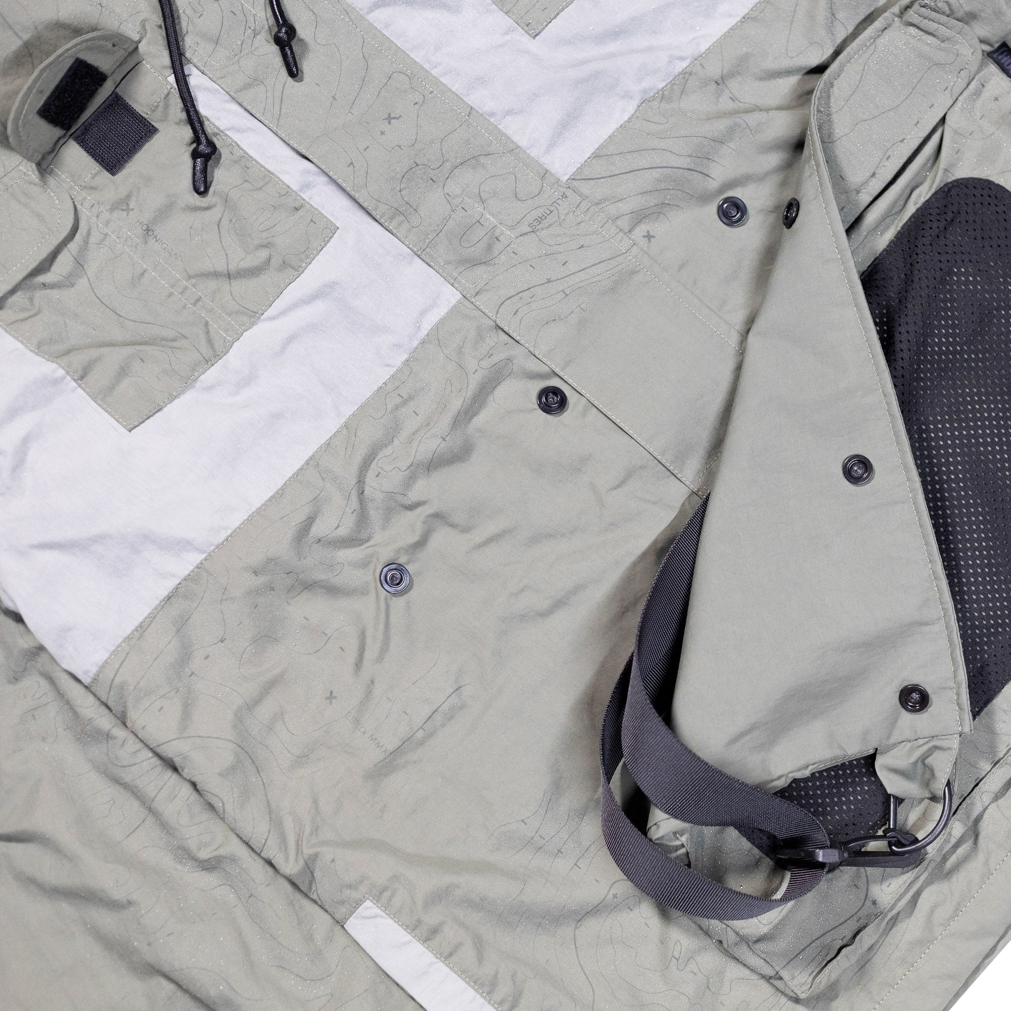 Rain-activated Hoonigan H.A.V.O.C. windbreaker jacket with adjustable straps, multiple pockets, and a lightweight, waterproof design.