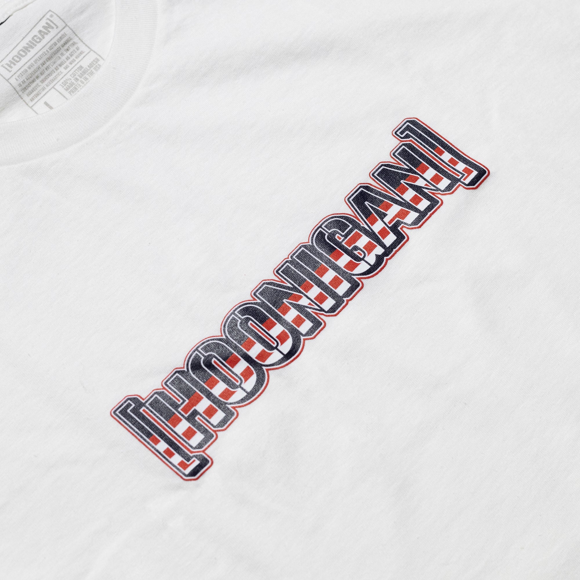 White short sleeve T-shirt with a bold "Hoonigan" logo printed vertically in black, red, and white across the front.
