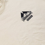 Close-up of a beige Hoonigan SAFARI short sleeve tee featuring a black and white graphic logo on the chest.