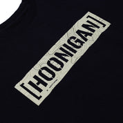 Black T-shirt with a beige rectangular graphic featuring "HOONIGAN" in bold black letters and a topographic map pattern.