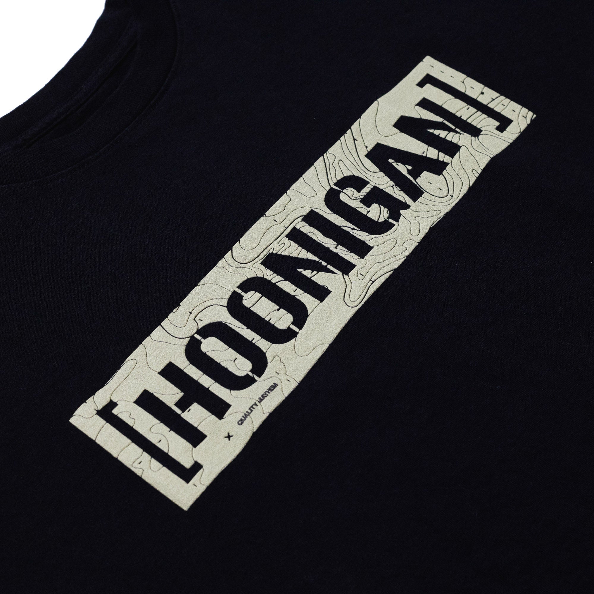 Black T-shirt with a beige rectangular graphic featuring "HOONIGAN" in bold black letters and a topographic map pattern.