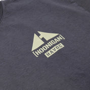 Close-up of a dark gray Hoonigan TOPOGRAHPHIC TERRAIN short sleeve T-shirt with a white printed logo featuring mountain peaks and bold text.