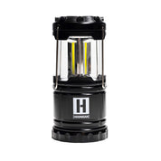 Hoonigan H.A.V.O.C. lantern with a black body, clear protective casing, and yellow LED strips, featuring the Hoonigan logo.