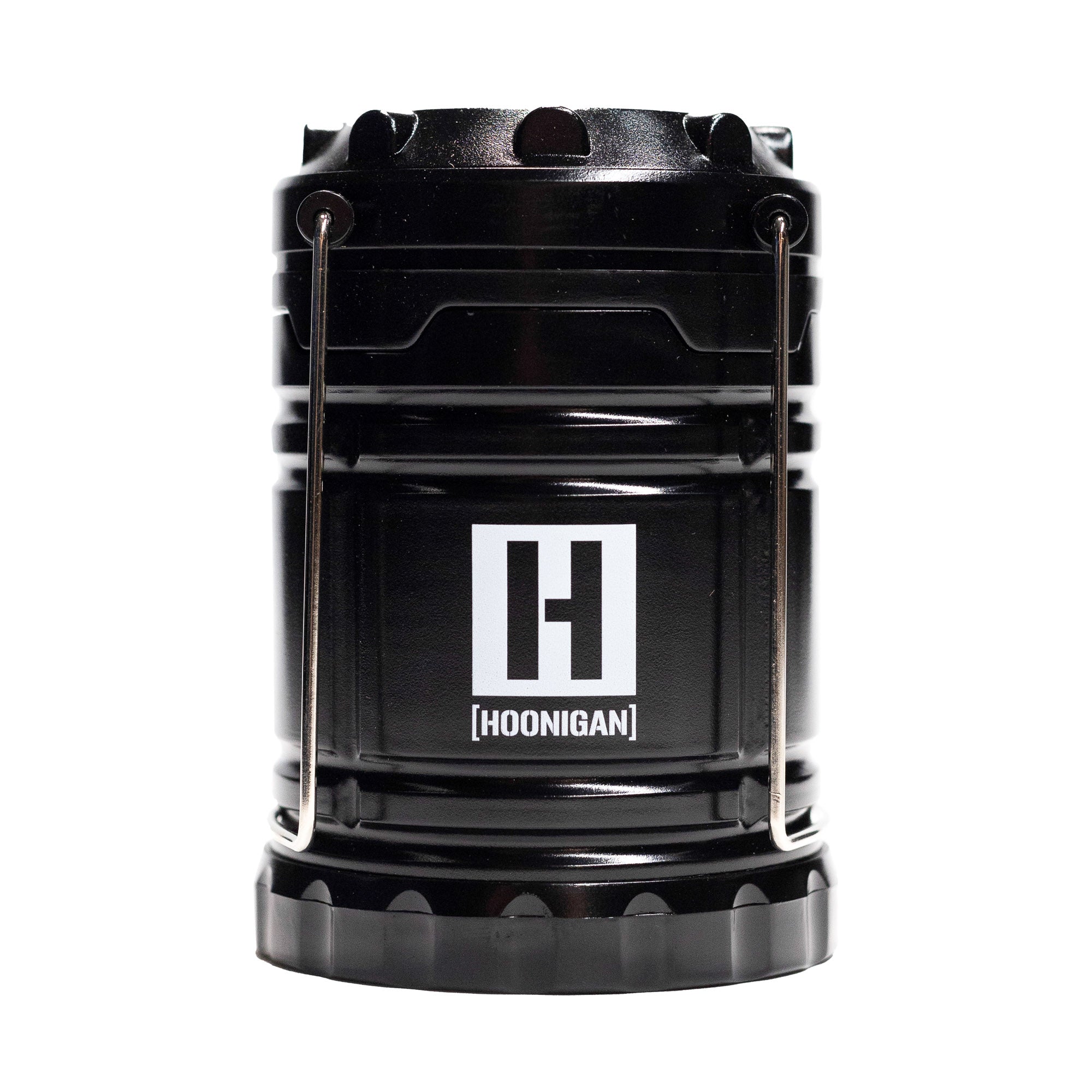 Black Hoonigan H.A.V.O.C. lantern with a white logo, metal handle, and rugged design, ideal for outdoor or automotive use.