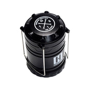 Hoonigan H.A.V.O.C. lantern with a black cylindrical design, metal handle, and white logo, used as a portable LED light or lantern.