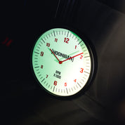 Hoonigan RPM Glow Clock featuring a luminous face with red hands and bold RPM markings for automotive enthusiasts.