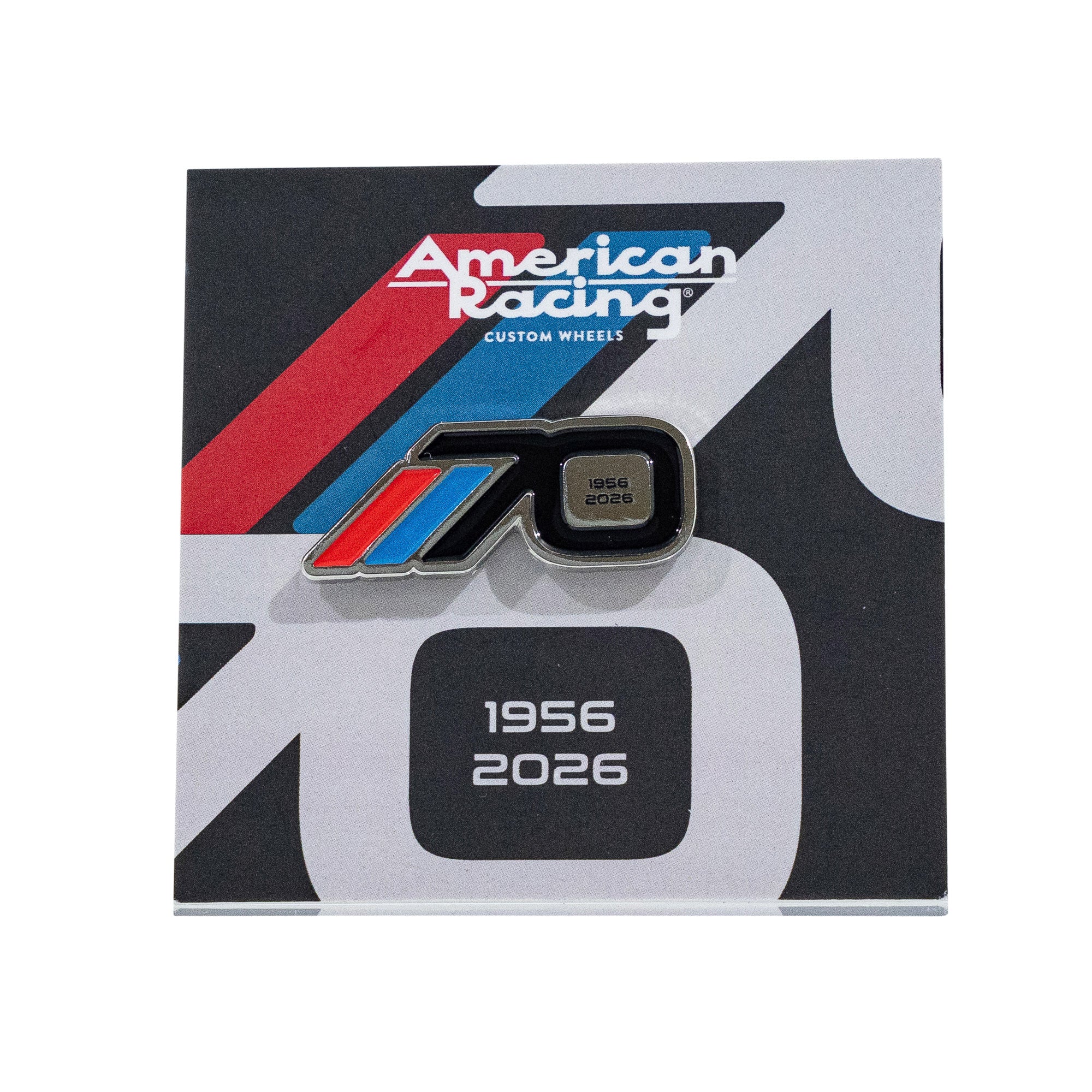 American Racing 70th anniversary collectible pin featuring a sleek design with blue and red accents, dated 1956-2026.