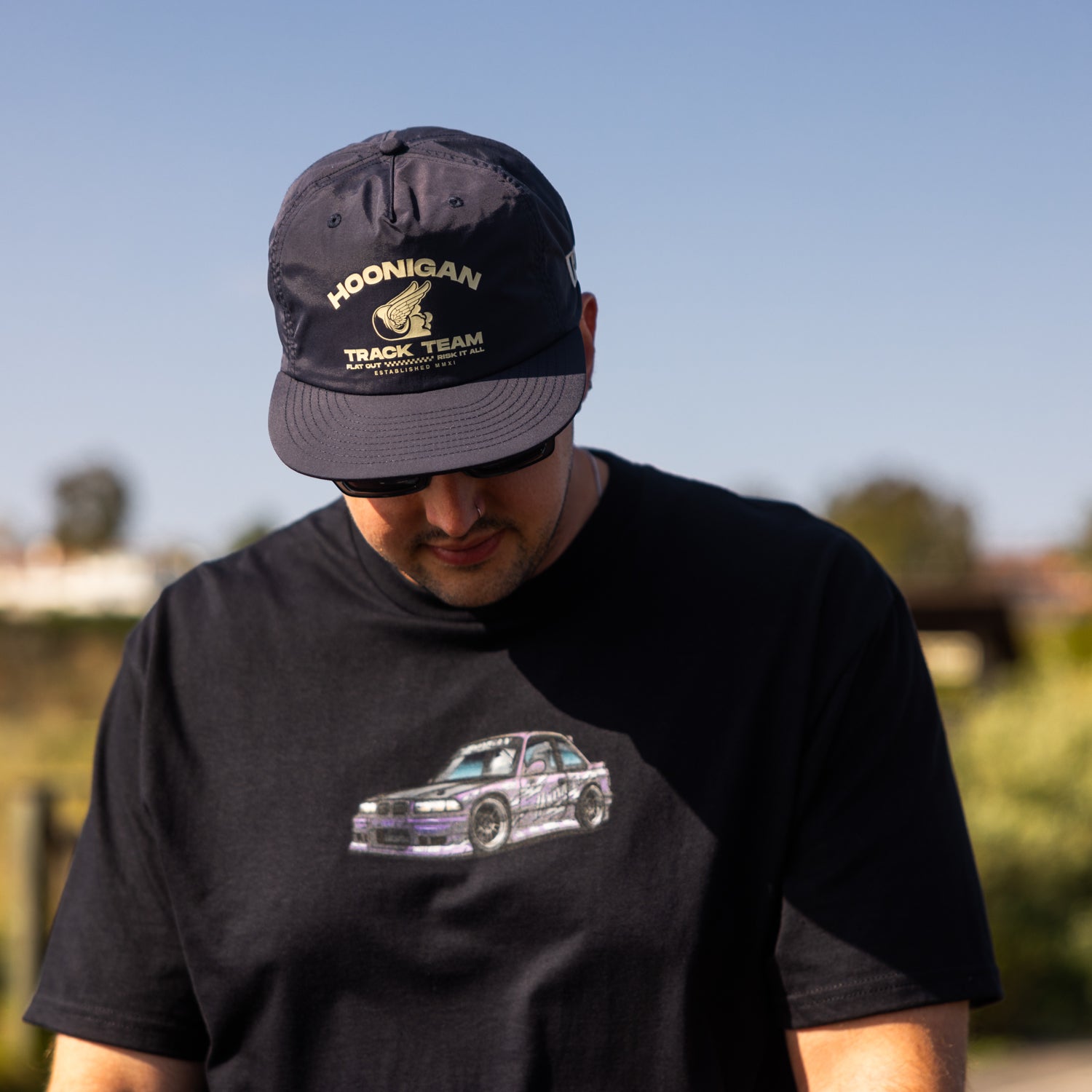 Hoonigan SD Series short sleeve tee in black with bold white logo graphic on the front.