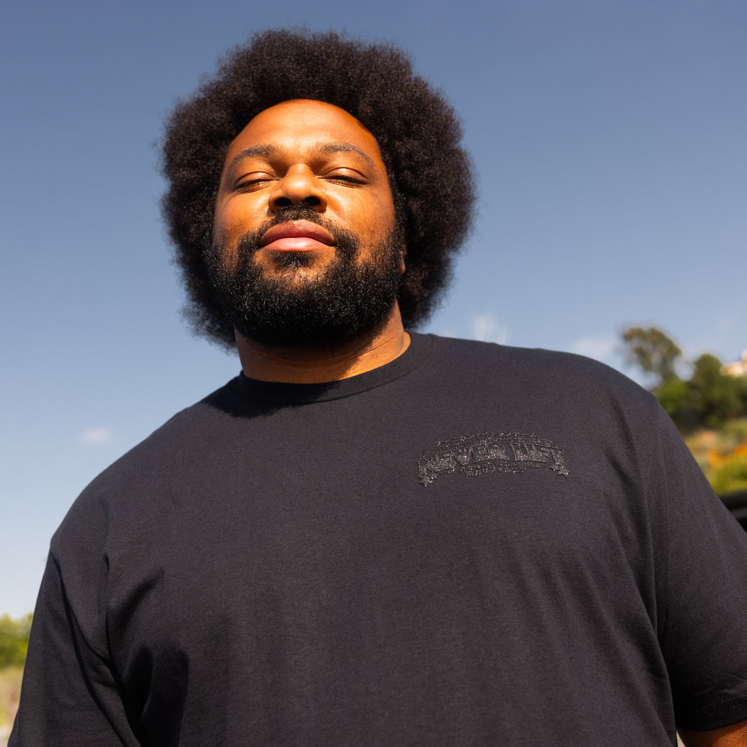 Hoonigan NIGHT RUNNERS Short Sleeve Tee featuring a bold graphic design on a black fabric, perfect for automotive enthusiasts.