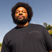 Hoonigan NIGHT RUNNERS Short Sleeve Tee featuring a bold graphic design on a black fabric, perfect for automotive enthusiasts.