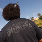 Hoonigan NIGHT RUNNERS Short Sleeve Tee featuring a graphic design on a black cotton fabric.