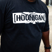 Front of the black Hoonigan SHATTERED CENSOR BAR tee with the cracked censor bar logo.