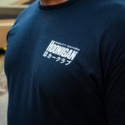 Front of the black Hoonigan 86 CREW tee with a small white QUALITY MAYHEM HOONIGAN logo and Japanese text.