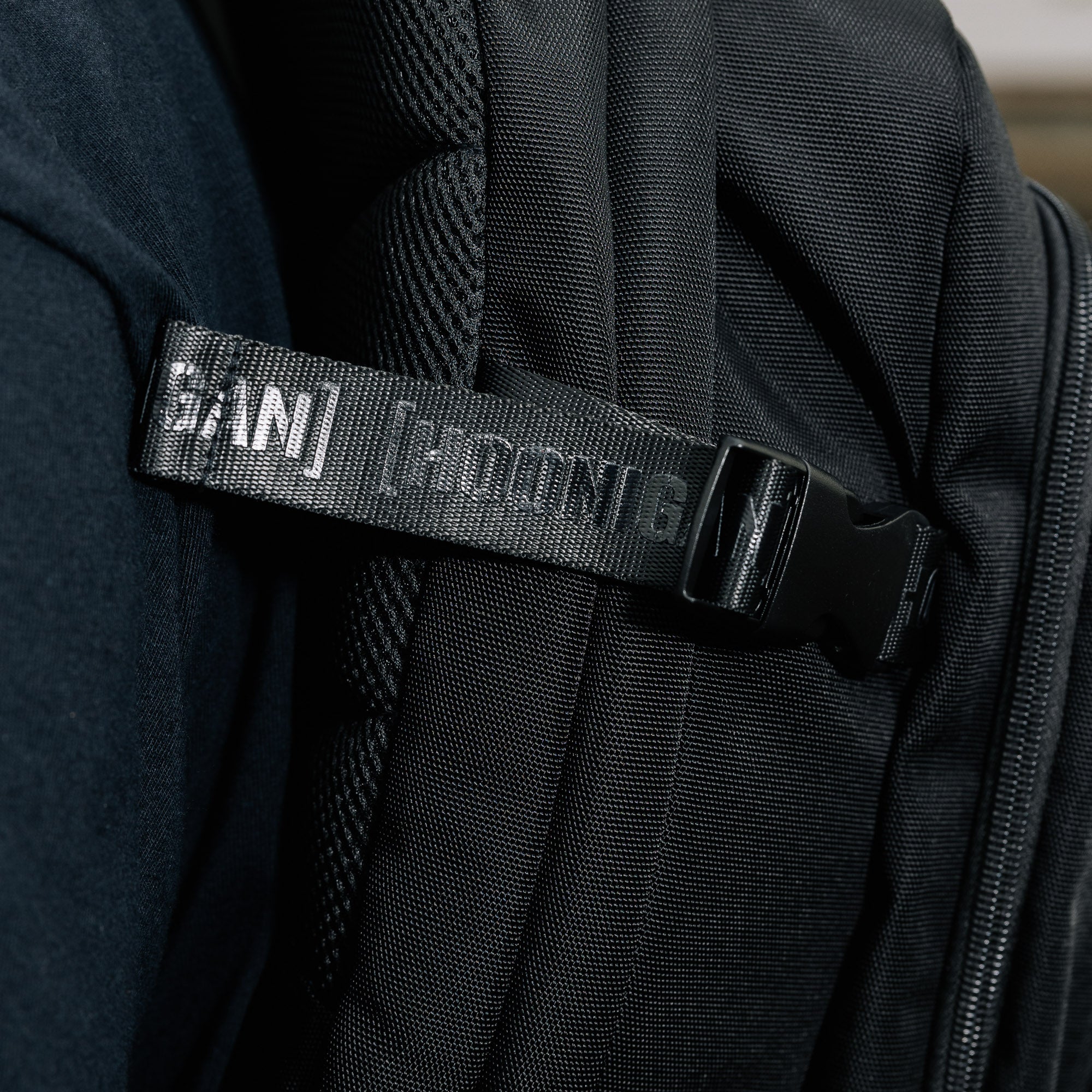 Hoonigan RATCHET STRAP Backpack featuring a unique strap design, black and neon color scheme, and multiple compartments.