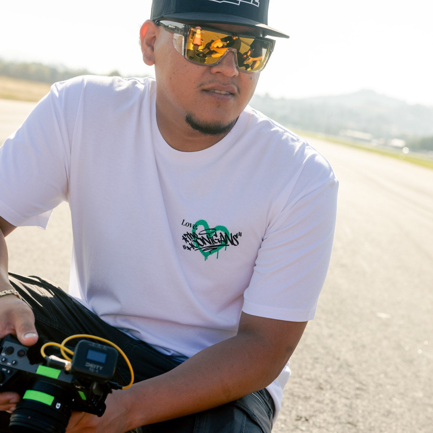 Hoonigan FIND OUT 2.0 Short Sleeve Tee featuring bold graphic design on a black fabric, ideal for motorsport enthusiasts.