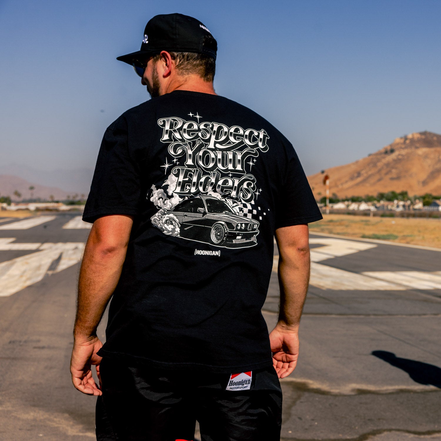 Hoonigan RESPECT YOUR ELDERS Short Sleeve Tee featuring bold graphic text on a black background.