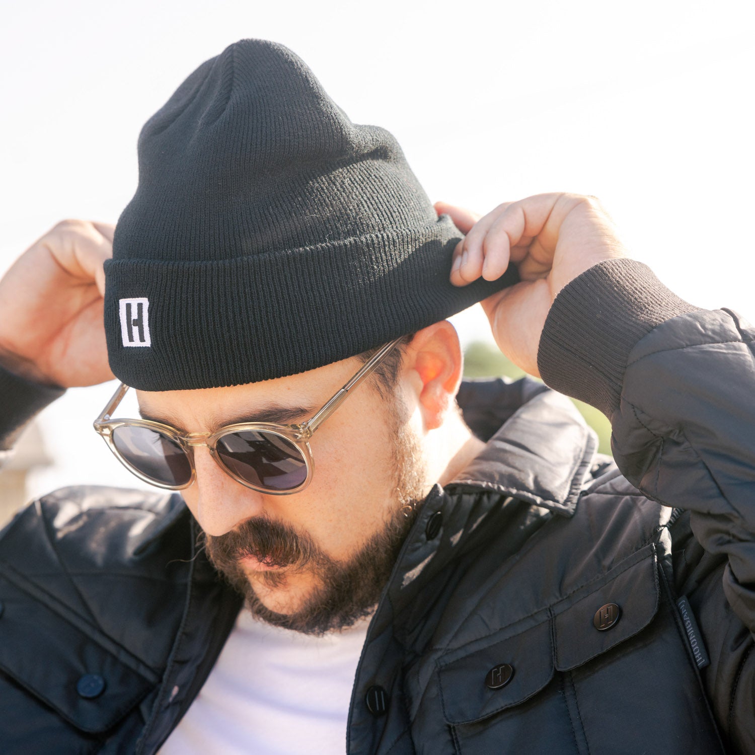 Hoonigan CLASSIC H ICON beanie in black with white logo, designed for stylish headwear.
