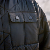 Hoonigan Motorsports VICTOR Quilted Jacket in black with logo detailing and quilted design.