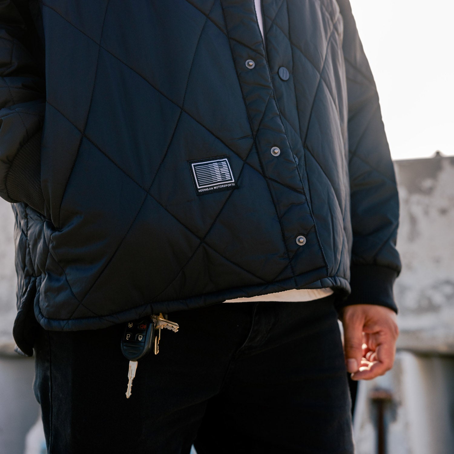 Hoonigan Motorsports VICTOR Quilted Jacket in black, featuring a stylish quilted design and logo on the chest.