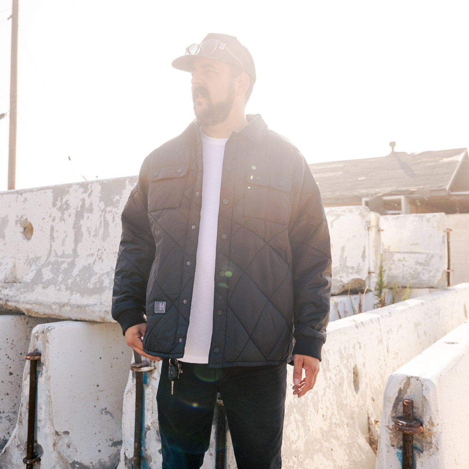 Hoonigan Motorsports VICTOR Quilted Jacket, featuring a stylish black design with quilted detailing and the Hoonigan logo on the front.