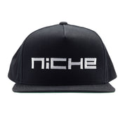 Niche SNAPBACK Hat in black with white logo design, featuring an adjustable snap closure.
