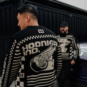Hoonigan TIRE SLAYER Ugly Xmas Pullover featuring a festive design with tire and Christmas motifs in bold colors.