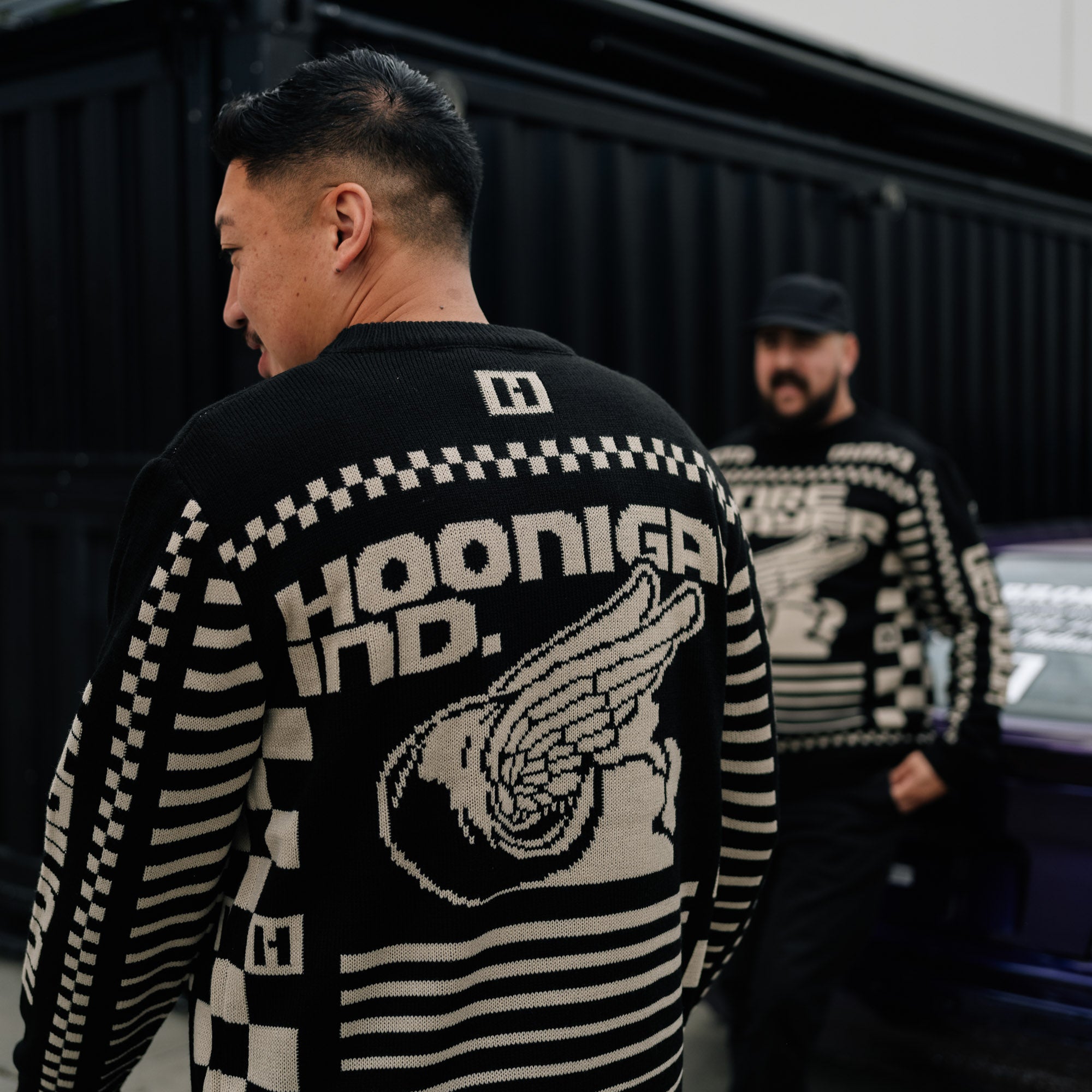 Hoonigan TIRE SLAYER Ugly Xmas Pullover featuring a festive design with tire and Christmas motifs in bold colors.