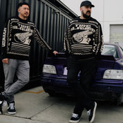 Hoonigan TIRE SLAYER Ugly Xmas Pullover featuring a colorful holiday design with automotive-themed graphics.